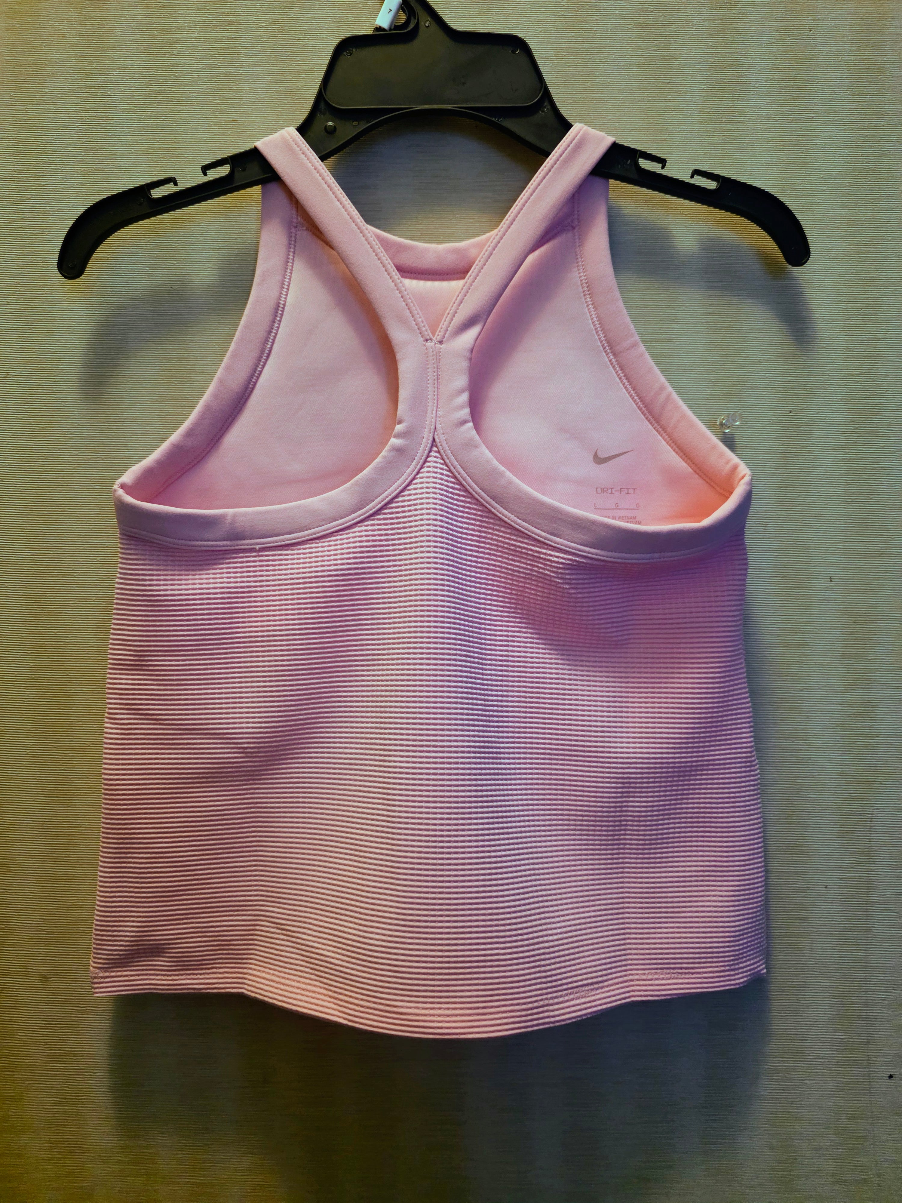 Brand New Nike Dri-FIT Girls' Tank Top with Tags! 💖Elevate her active style with this beautiful Nike high-neck tank top! Designed with moisture-wicking Dri-FIT technology, it keeps her cool and dry during any activity. It features a stylish criss-cross r